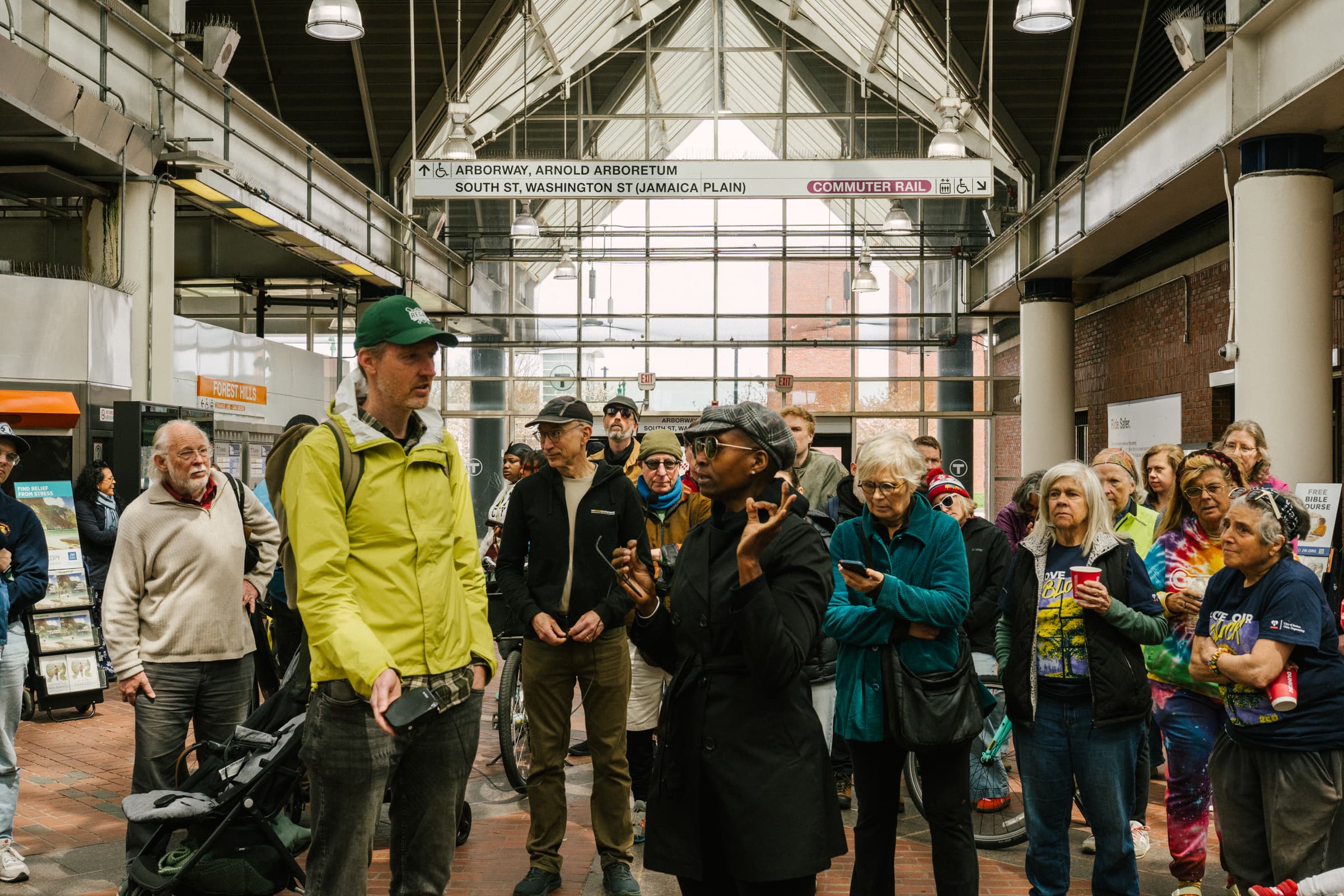 Resident speaking at the Hyde Park Avenue safety walk at Forest Hills station